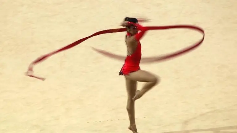 Ana Carrasco Pini, of Argentina, performs with the ribbon in the individual all-around rhythmic gymnastics competitions during the 2011 Pan American Games in Guadalajara, Mexico, Saturday, Oct. 15, 2011.(AP Photo/Dario Lopez-Mills)